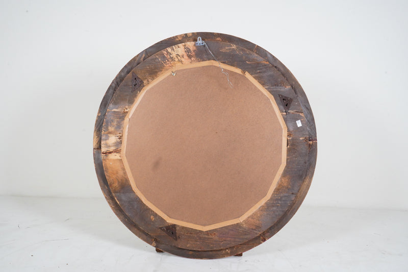 A Carved Mango Wood Round Mirror Frame