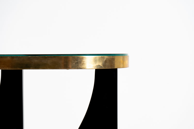 A Modern Console Table With Lacquered Base and Black Glass Top
