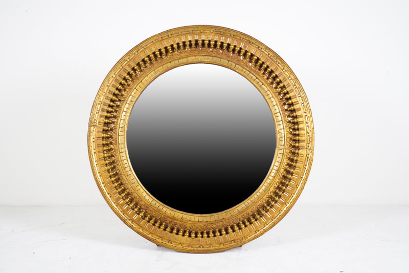 A Carved Mango Wood Round Mirror Frame
