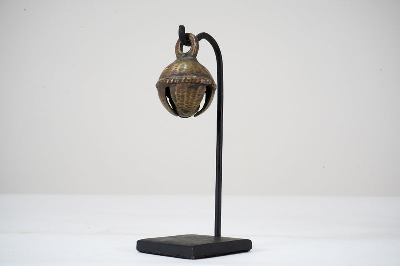 A Brass Cow Bell with Metal Stand