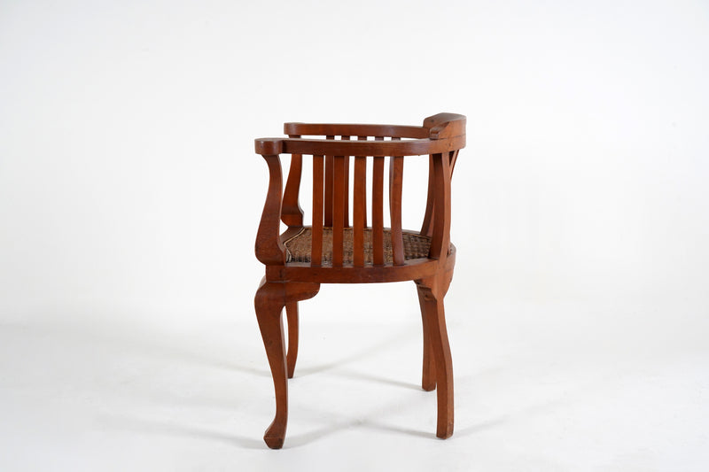 A British Colonial Teak Wood Chair with a Rattan Seat