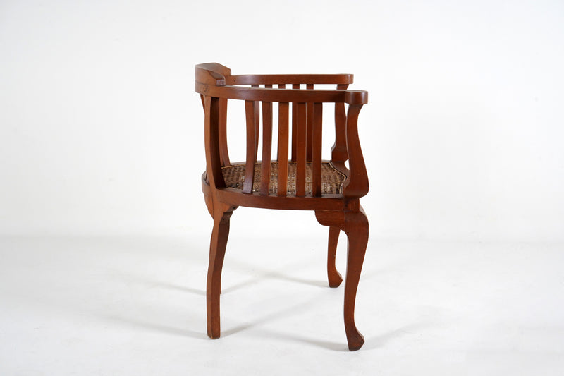 A British Colonial Teak Wood Chair with a Rattan Seat