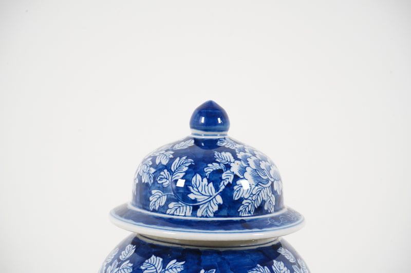 A Tall Blue and White Vase with Lid