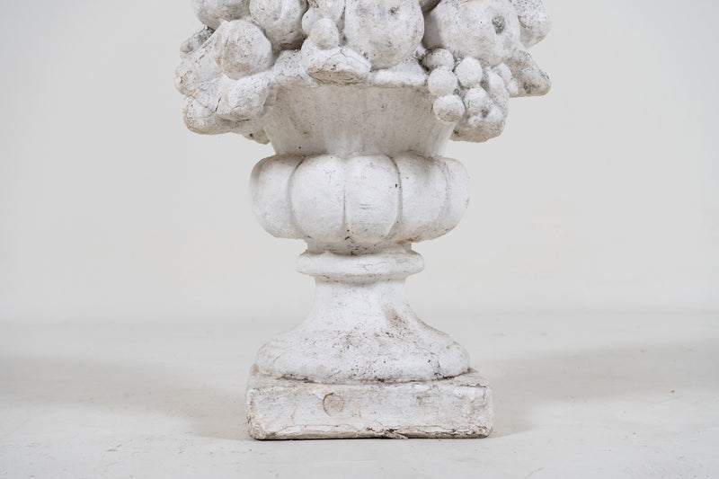 A Cement Urn in The Form of a Fruit Cluster