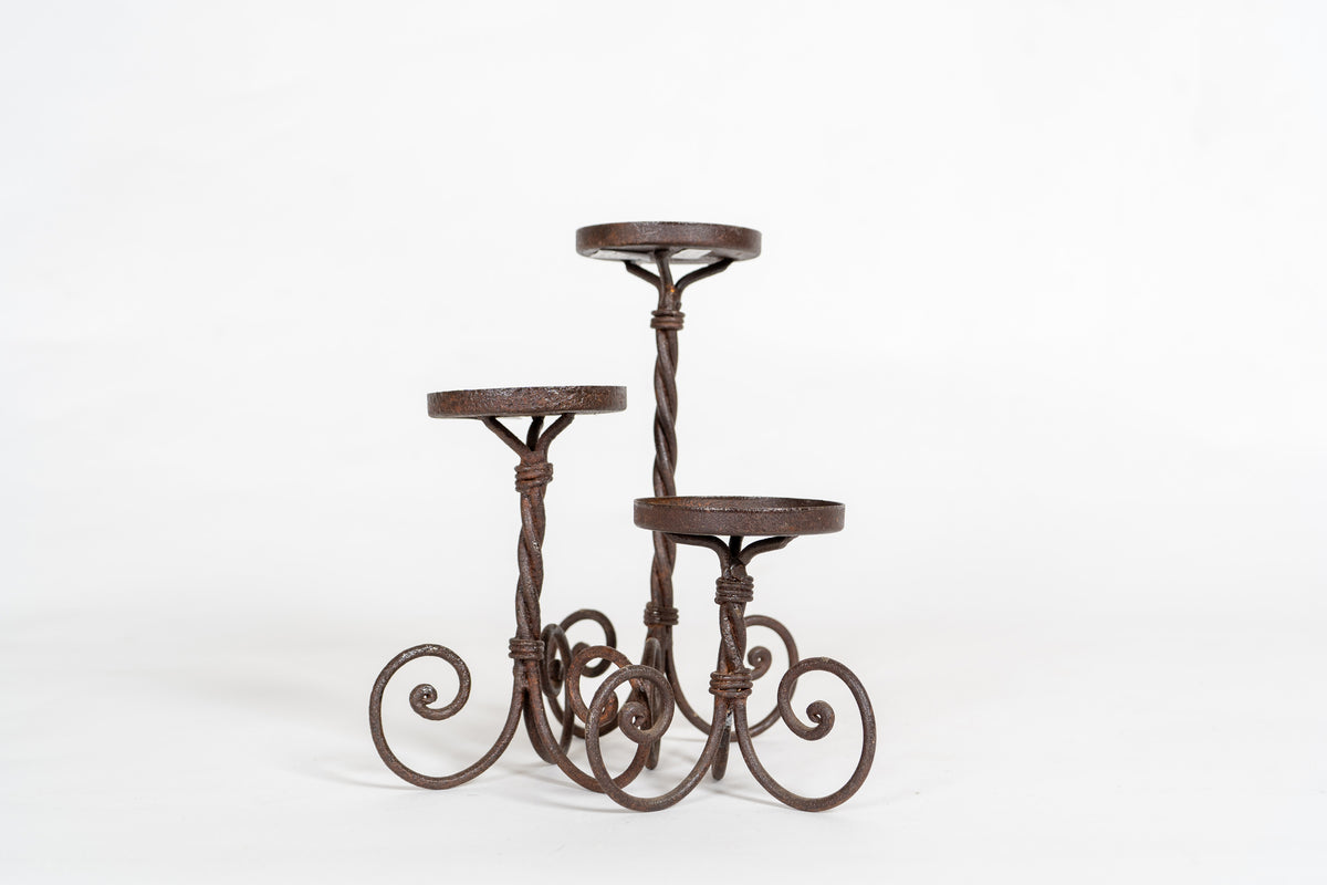 A Set of 3 Twisted Iron Candle Holders