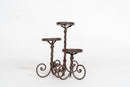 A Set of 3 Twisted Iron Candle Holders