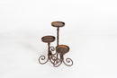 A Set of 3 Twisted Iron Candle Holders