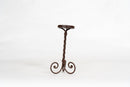 A Set of 3 Twisted Iron Candle Holders