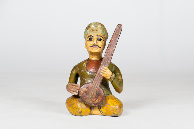 Small Wooden Figure of Musician Playing Sitar