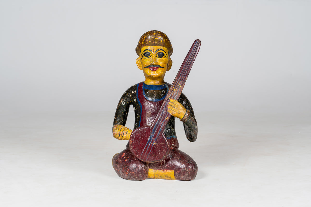 Wooden Musician Playing Sitar