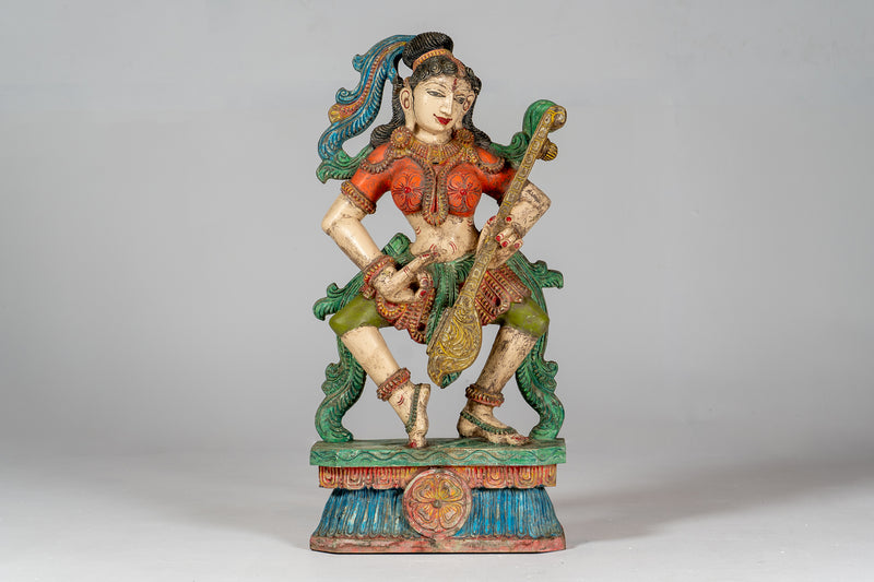 A Carved Teak Saraswati Figure