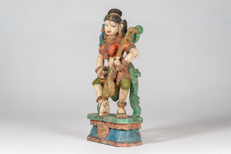 A Carved Teak Saraswati Figure