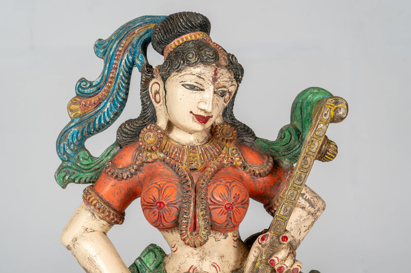 A Carved Teak Saraswati Figure