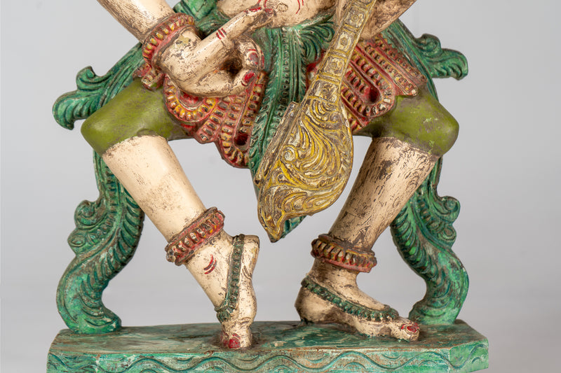 A Carved Teak Saraswati Figure