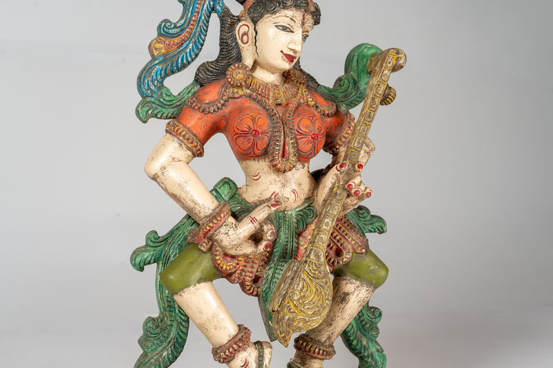 A Carved Teak Saraswati Figure