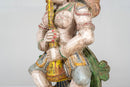 A Wooden Sculpture of a Musician Angel Playing Flute