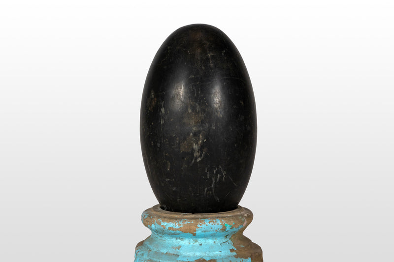 An Aniconic Lingam on a Stone Base
