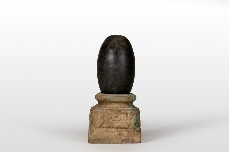 An Aniconic Lingam on a Stone Base