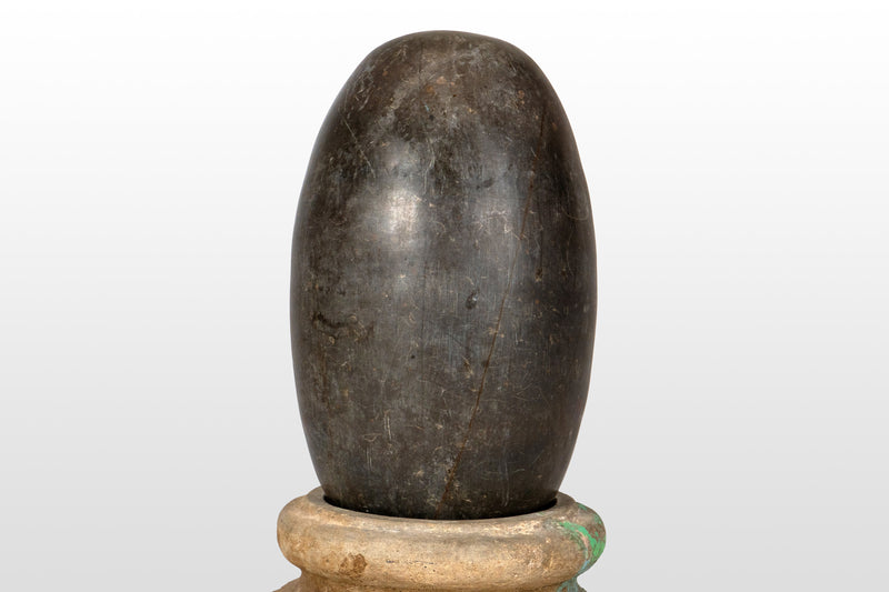 An Aniconic Lingam on a Stone Base