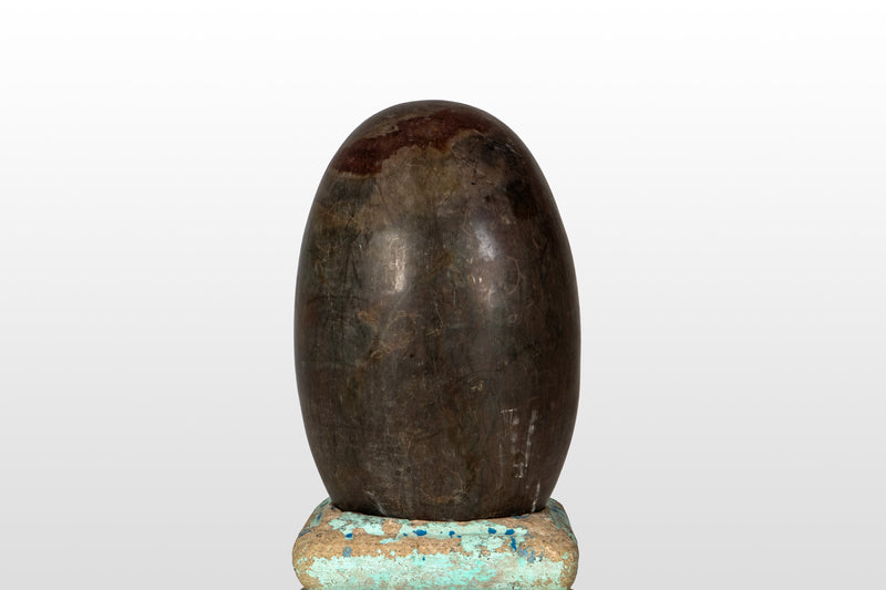 An Aniconic Lingam on a Stone Base