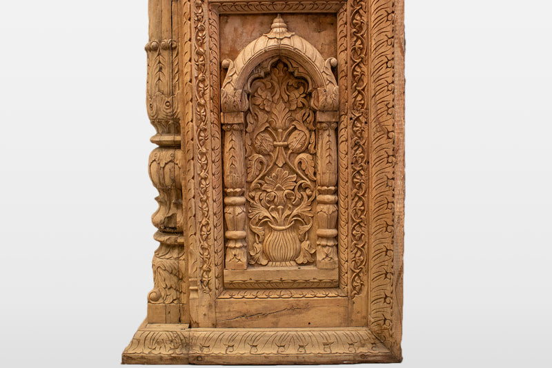 A Wooden Indian Colonnade With Five Arches and Candle Alcoves