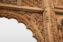 A Wooden Indian Colonnade With Five Arches and Candle Alcoves