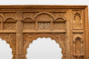 A Wooden Indian Colonnade With Five Arches and Candle Alcoves
