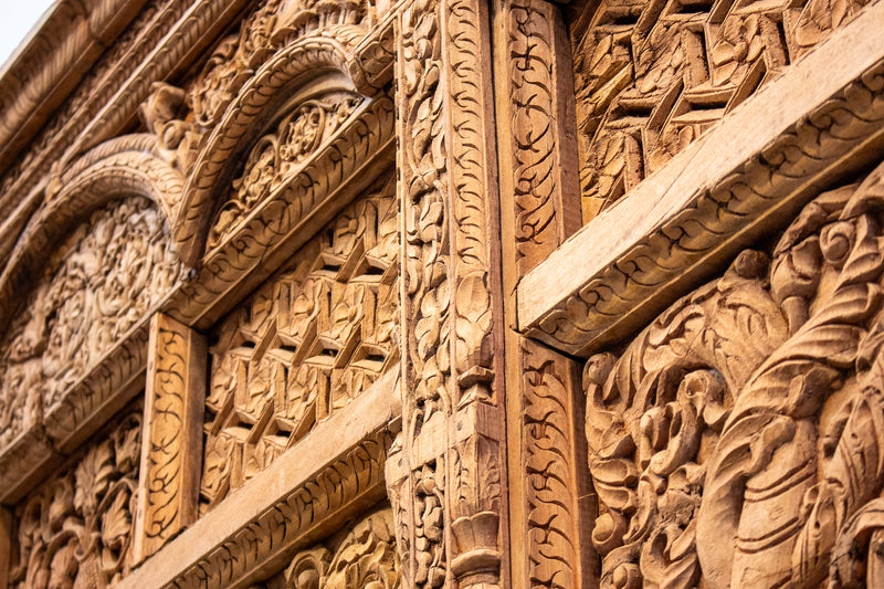 A Wooden Indian Colonnade With Five Arches and Candle Alcoves