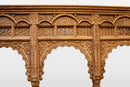 A Wooden Indian Colonnade With Five Arches and Candle Alcoves