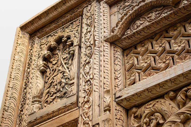 A Wooden Indian Colonnade With Five Arches and Candle Alcoves