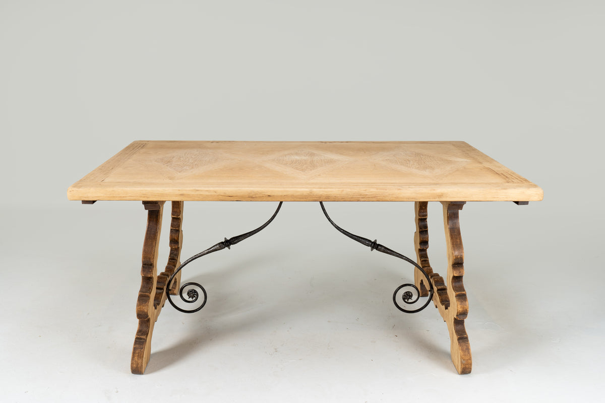 A Spanish Oak Dining Table with Two Leaf Extensions