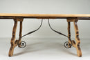 A Spanish Oak Dining Table with Two Leaf Extensions