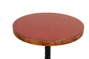 A Round Bistro Table With an Iron Base