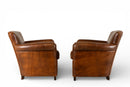 A Pair of French Leather Armchairs