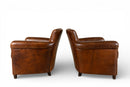 A Pair of French Leather Armchairs