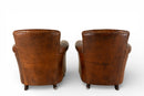 A Pair of French Leather Armchairs