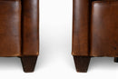 A Pair of French Leather Armchairs