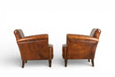 A Pair of Petite Leather Chairs