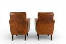 A Pair of Petite Leather Chairs