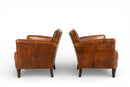 A Pair of Petite Leather Chairs