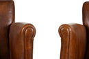 A Pair of Petite Leather Chairs