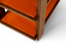 A Vintage Art Deco Style Bar Cart With Orange Glass Shelves