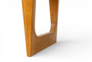 A Bench With a Cushioned Seat and Glass Table Top