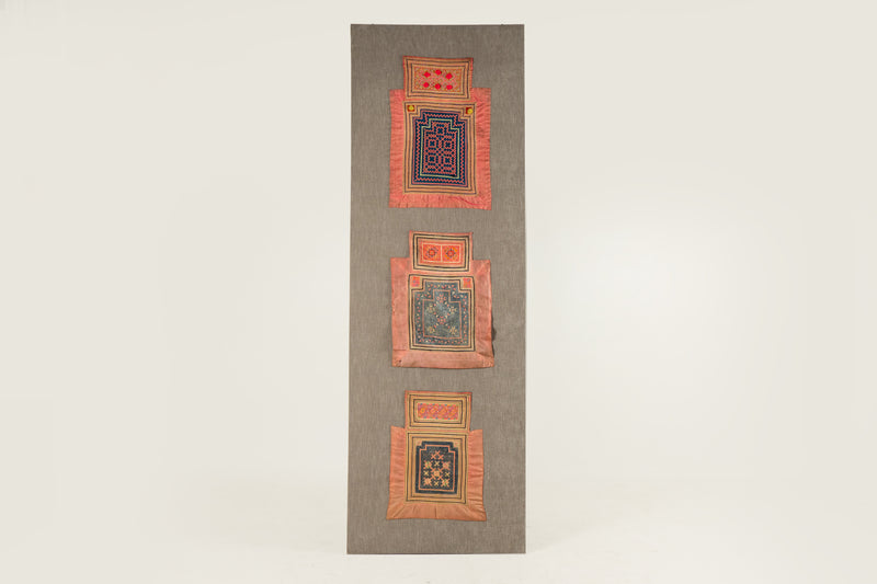A Vintage Hmong Baby Carrying Clothes on Frame