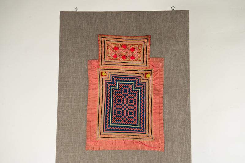 A Vintage Hmong Baby Carrying Clothes on Frame