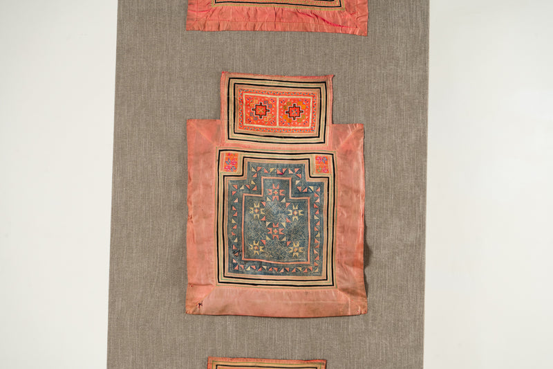 A Vintage Hmong Baby Carrying Clothes on Frame