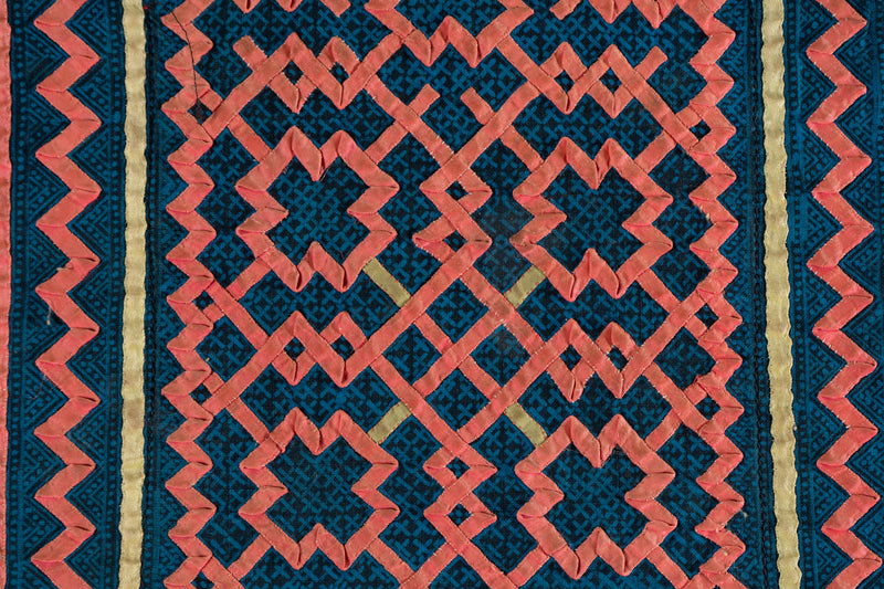 A Vintage Hmong Baby Carrying Clothes on Frame