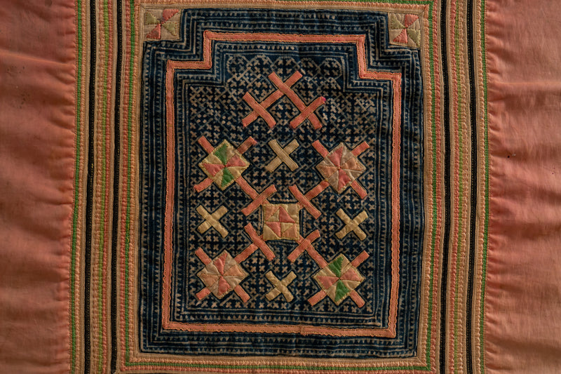 A Vintage Hmong Baby Carrying Clothes on Frame
