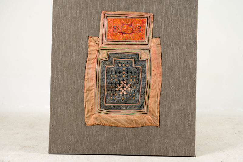 A Vintage Hmong Baby Carrying Clothes on Frame
