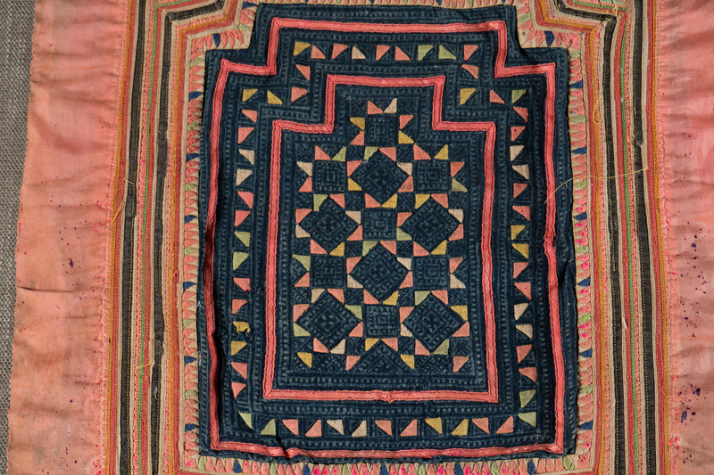 A Vintage Hmong Baby Carrying Clothes on Frame
